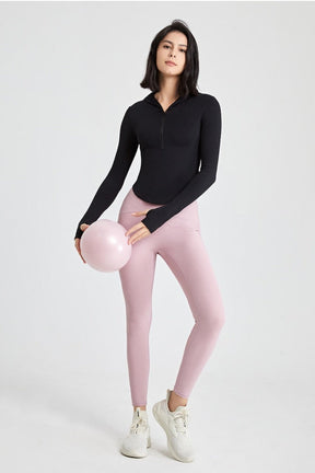 Long-sleeved fitness top with finger loops.